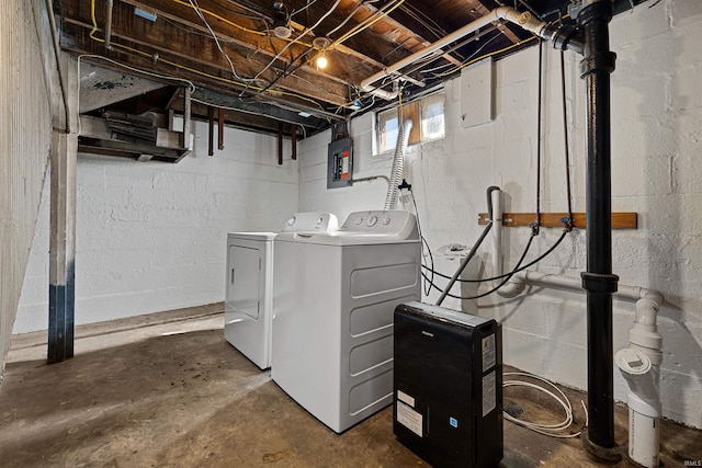 laundry area with electric panel, laundry area, and washing machine and dryer