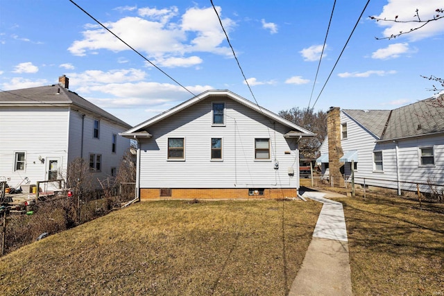 back of house with a yard and fence