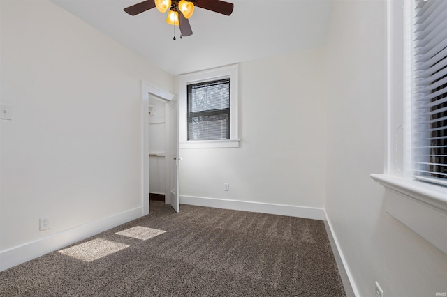 unfurnished bedroom featuring ceiling fan, baseboards, and carpet floors