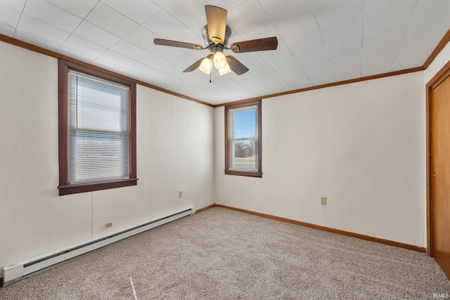 unfurnished room with baseboards, carpet, ornamental molding, baseboard heating, and a ceiling fan