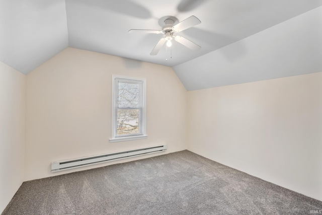 additional living space with a baseboard heating unit, vaulted ceiling, a ceiling fan, and carpet floors