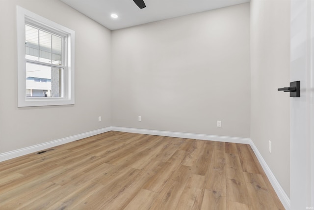 empty room with visible vents, baseboards, recessed lighting, light wood-style flooring, and a ceiling fan