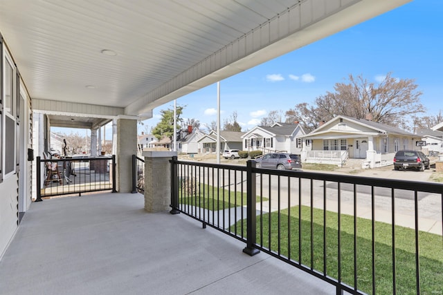 balcony featuring a residential view and a porch