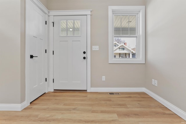 entrance foyer featuring visible vents, light wood-style flooring, and baseboards