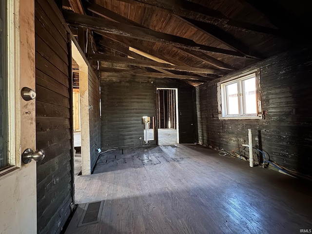 interior space with vaulted ceiling and visible vents