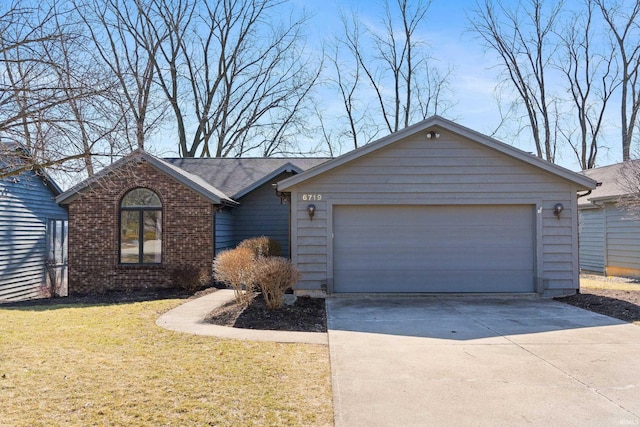 single story home featuring brick siding, driveway, a front yard, and a garage