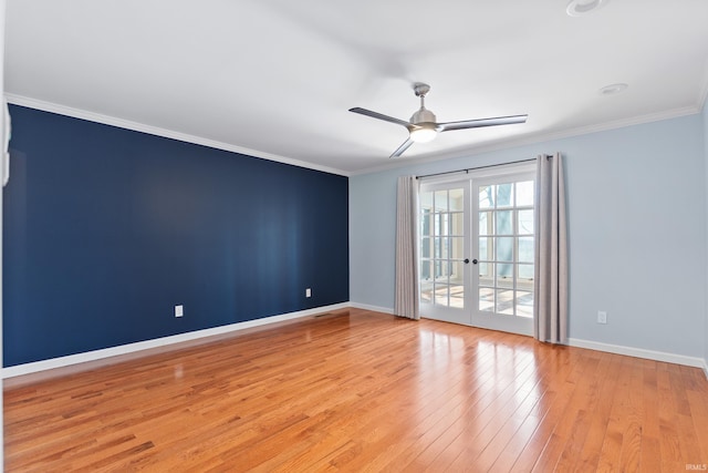 spare room with light wood-type flooring, french doors, ceiling fan, and crown molding