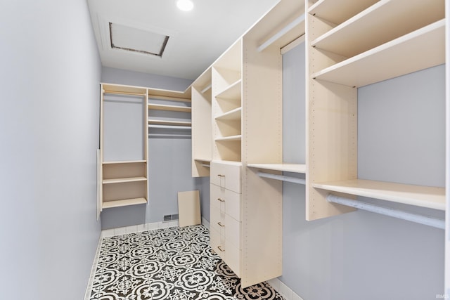 walk in closet with tile patterned flooring and visible vents