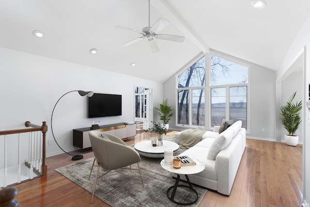 living area with baseboards, lofted ceiling with beams, recessed lighting, ceiling fan, and wood-type flooring