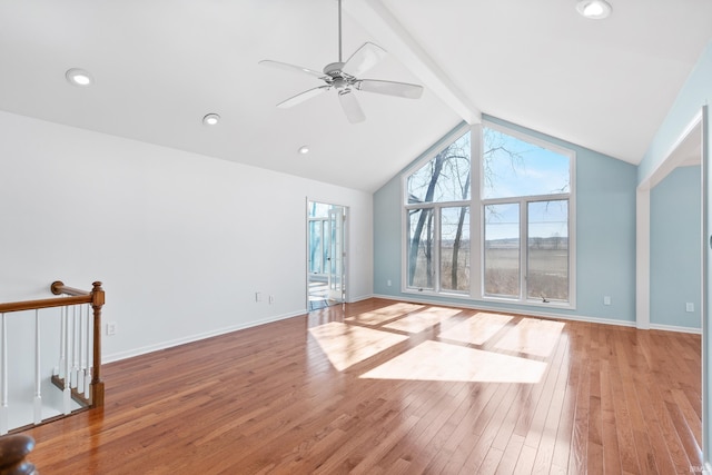 unfurnished living room featuring a ceiling fan, baseboards, lofted ceiling with beams, recessed lighting, and light wood-type flooring