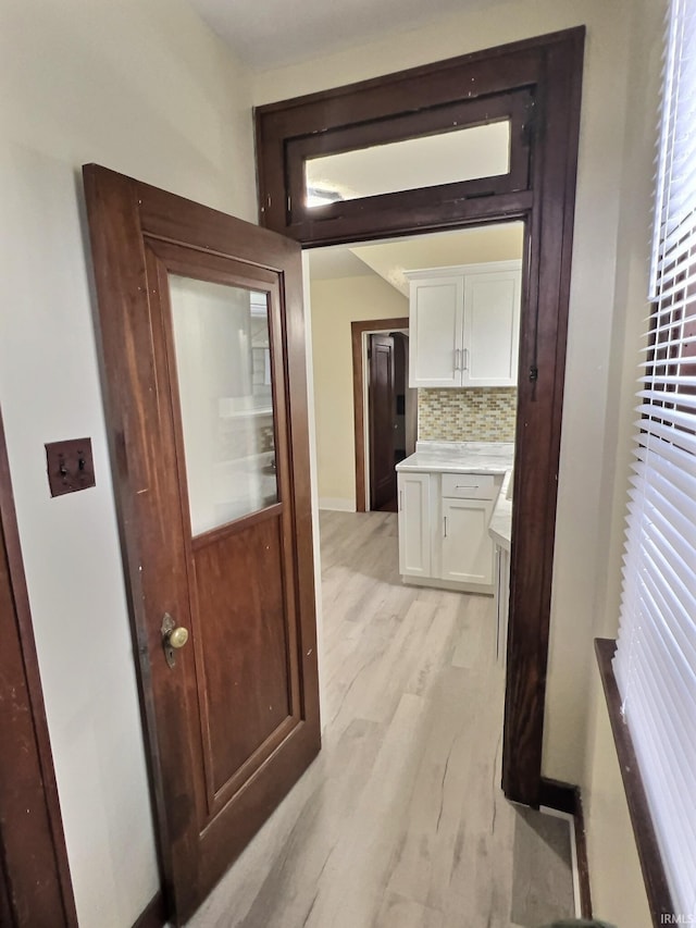 hallway featuring light wood-style flooring