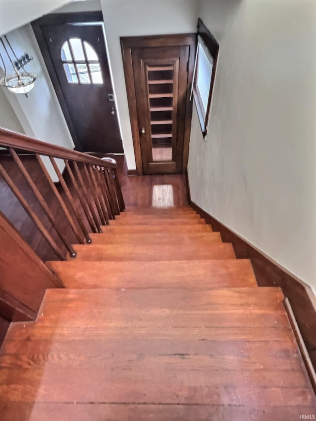 staircase with wood finished floors