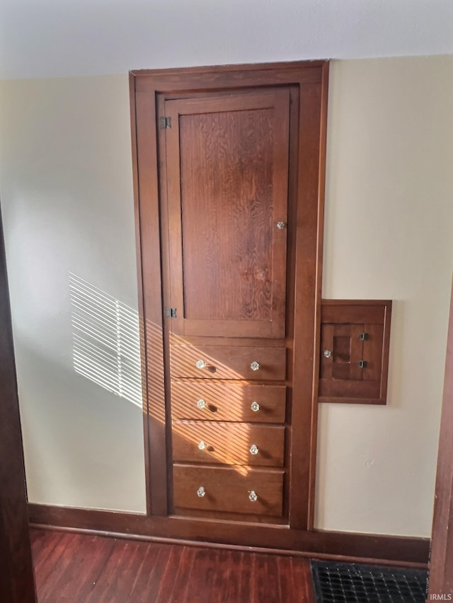 room details featuring wood finished floors and baseboards