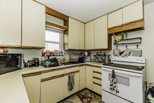 kitchen with light countertops, electric range, open shelves, and a sink