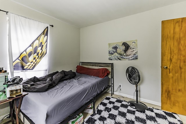 bedroom featuring baseboards