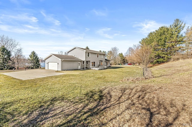 view of home's exterior with a lawn, an attached garage, and driveway