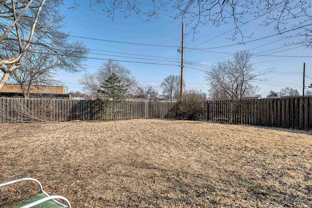 view of yard with a fenced backyard