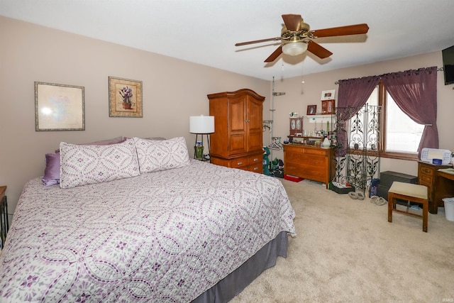 bedroom with light carpet and ceiling fan