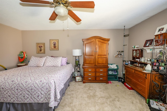 bedroom with a ceiling fan and light colored carpet