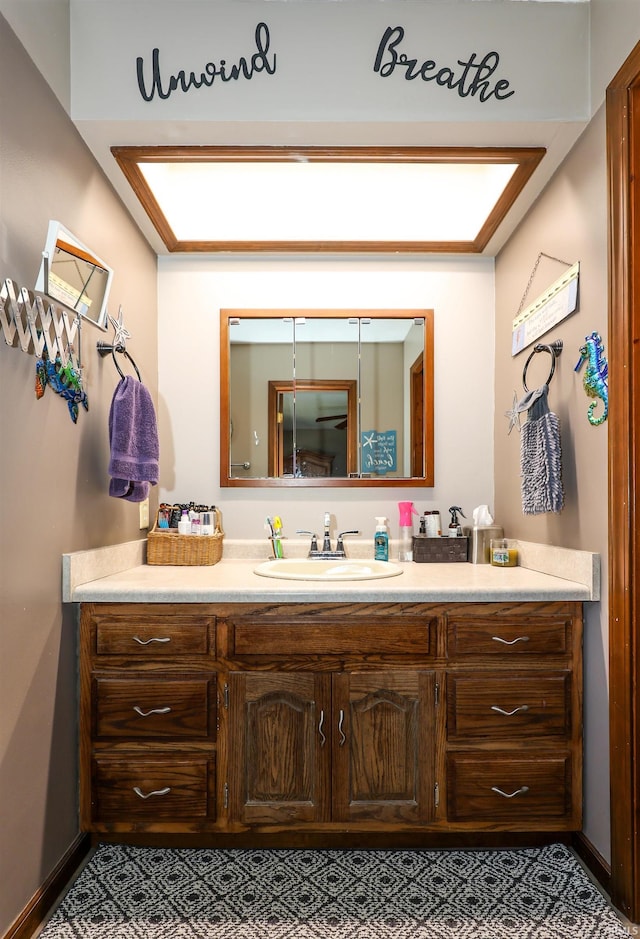 bathroom with vanity and tile patterned flooring