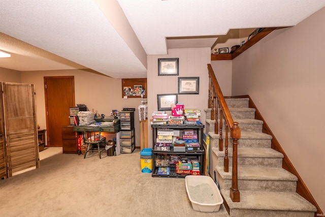 stairs with baseboards and carpet floors