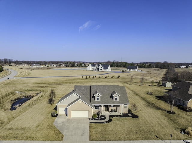 birds eye view of property with a rural view