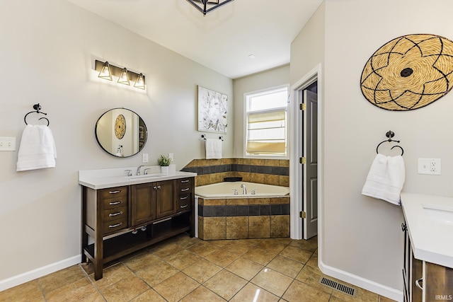 full bath with tile patterned floors, visible vents, vanity, and a garden tub