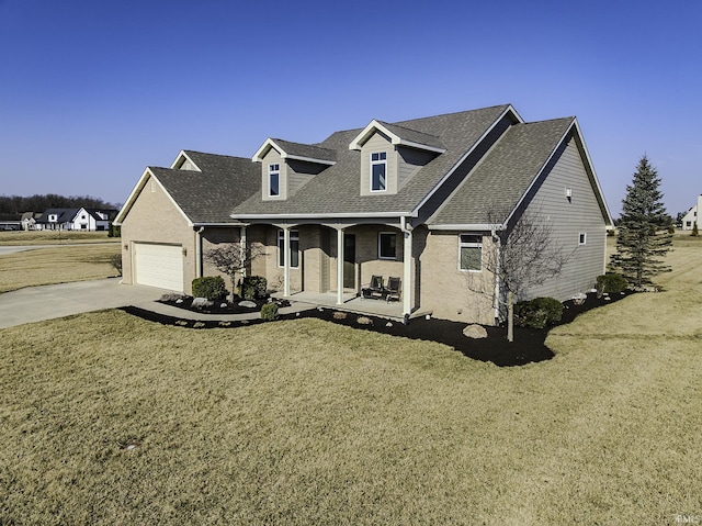 cape cod house featuring a garage, concrete driveway, a front yard, and a shingled roof