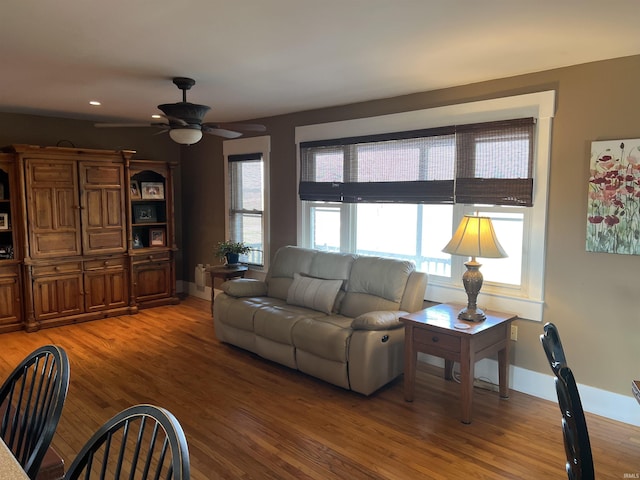 living room with recessed lighting, light wood-style flooring, baseboards, and ceiling fan