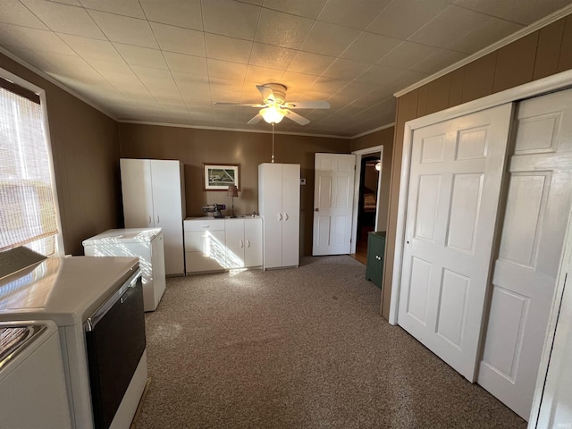 unfurnished bedroom with crown molding, a ceiling fan, carpet floors, and washer and clothes dryer