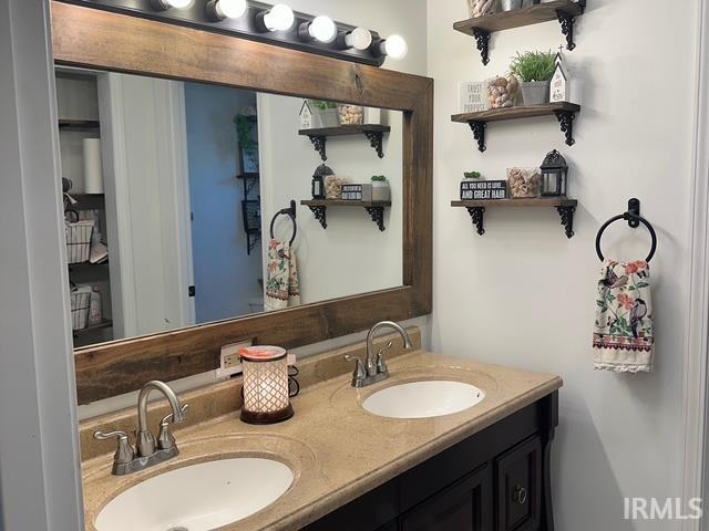 bathroom with double vanity and a sink