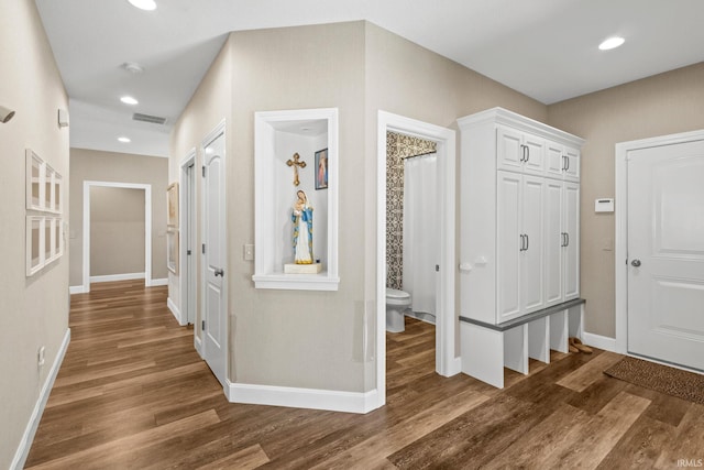 entryway featuring visible vents, recessed lighting, baseboards, and wood finished floors