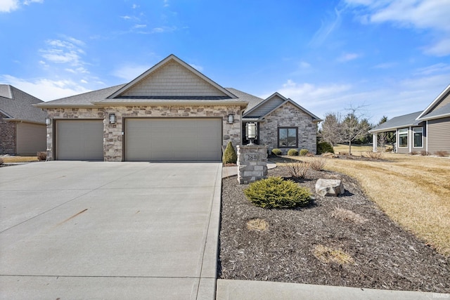 view of front facade with stone siding, a garage, driveway, and a shingled roof