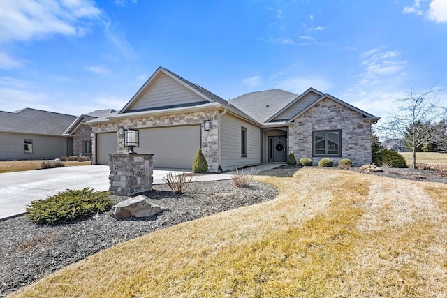 view of front of property with a garage, stone siding, and driveway