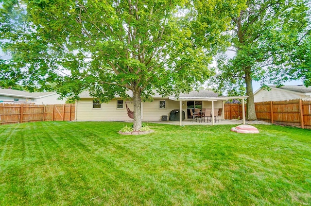 view of yard featuring a patio and a fenced backyard