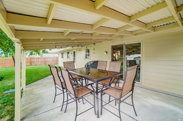 view of patio / terrace featuring outdoor dining space and fence