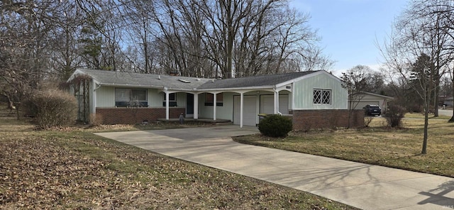 ranch-style home featuring concrete driveway, an attached garage, and brick siding