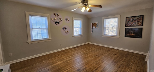 unfurnished room featuring dark wood finished floors, baseboards, and ceiling fan