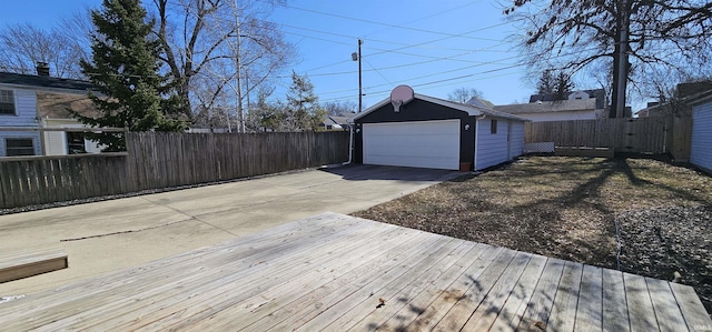 detached garage featuring fence