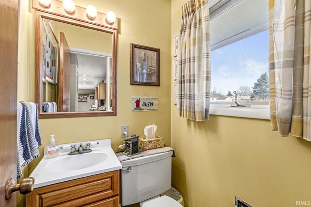 bathroom featuring vanity and toilet