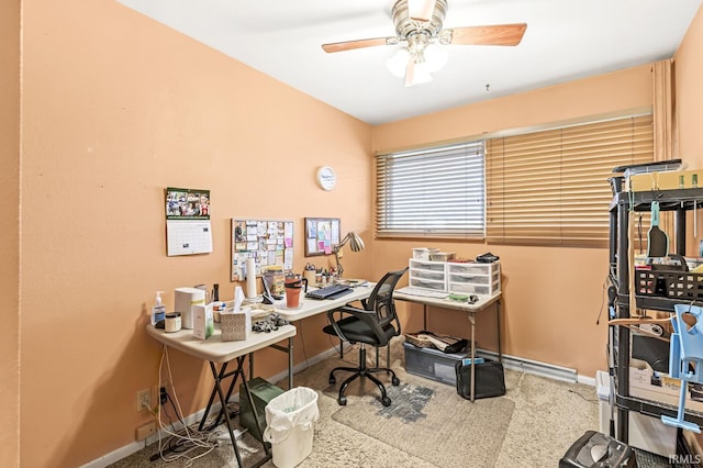 office space featuring baseboards and ceiling fan