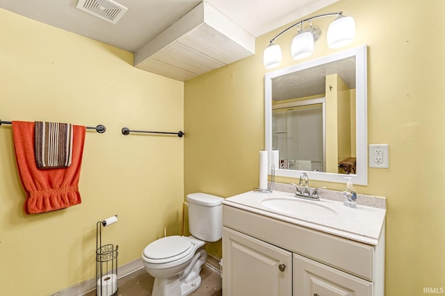 half bath featuring vanity, toilet, baseboards, and visible vents