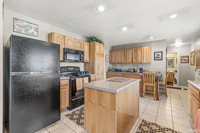 kitchen featuring black appliances, a kitchen island, recessed lighting, light tile patterned flooring, and light countertops