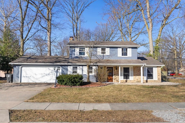 traditional-style house featuring brick siding, a front lawn, a chimney, a garage, and driveway