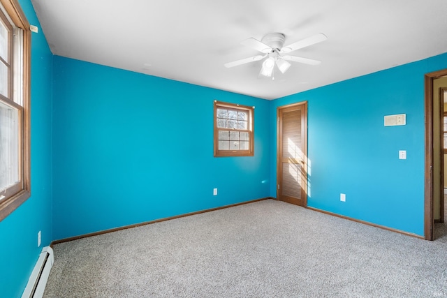 unfurnished bedroom featuring a ceiling fan, a closet, carpet floors, baseboards, and baseboard heating