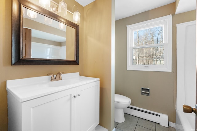 bathroom featuring toilet, a baseboard heating unit, tile patterned flooring, baseboards, and vanity