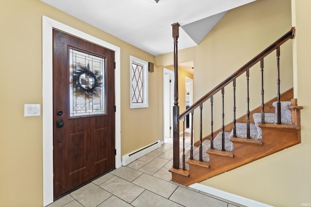 foyer entrance featuring stairway, light tile patterned floors, baseboards, and a baseboard radiator