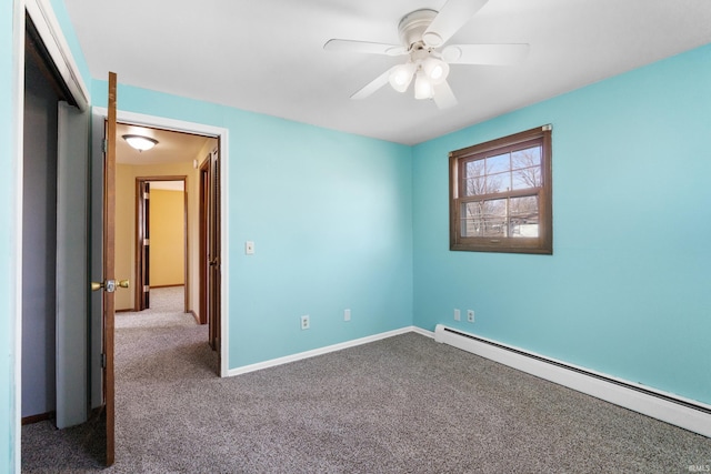 unfurnished bedroom featuring ceiling fan, baseboards, a baseboard heating unit, and carpet