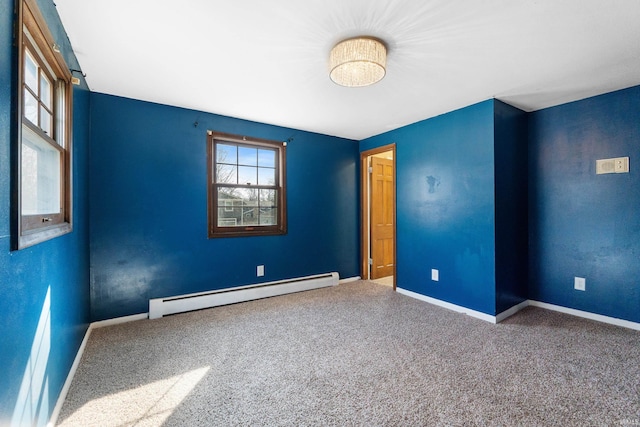 carpeted empty room with baseboards and baseboard heating