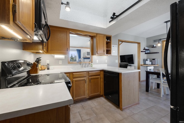 kitchen with open shelves, a sink, black appliances, light countertops, and a textured ceiling